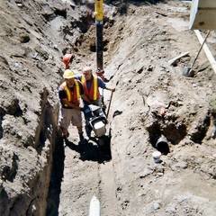 Workmen in trench