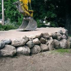 Excavator constructing raised driveway 1