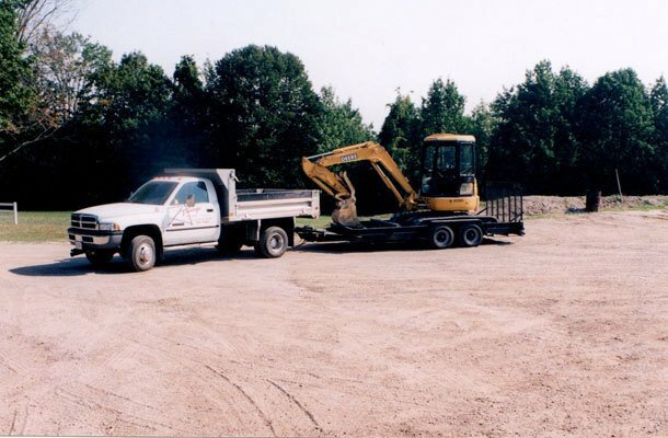 truck towing excavator